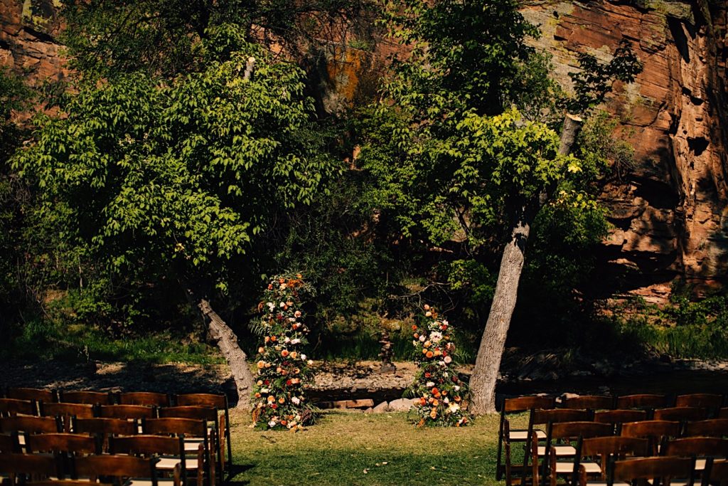 Ceremony space for a wedding at Planet Bluegrass decorated with flowers