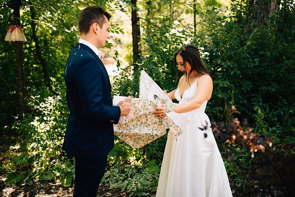 Bride and groom exchange gifts before their wedding ceremony