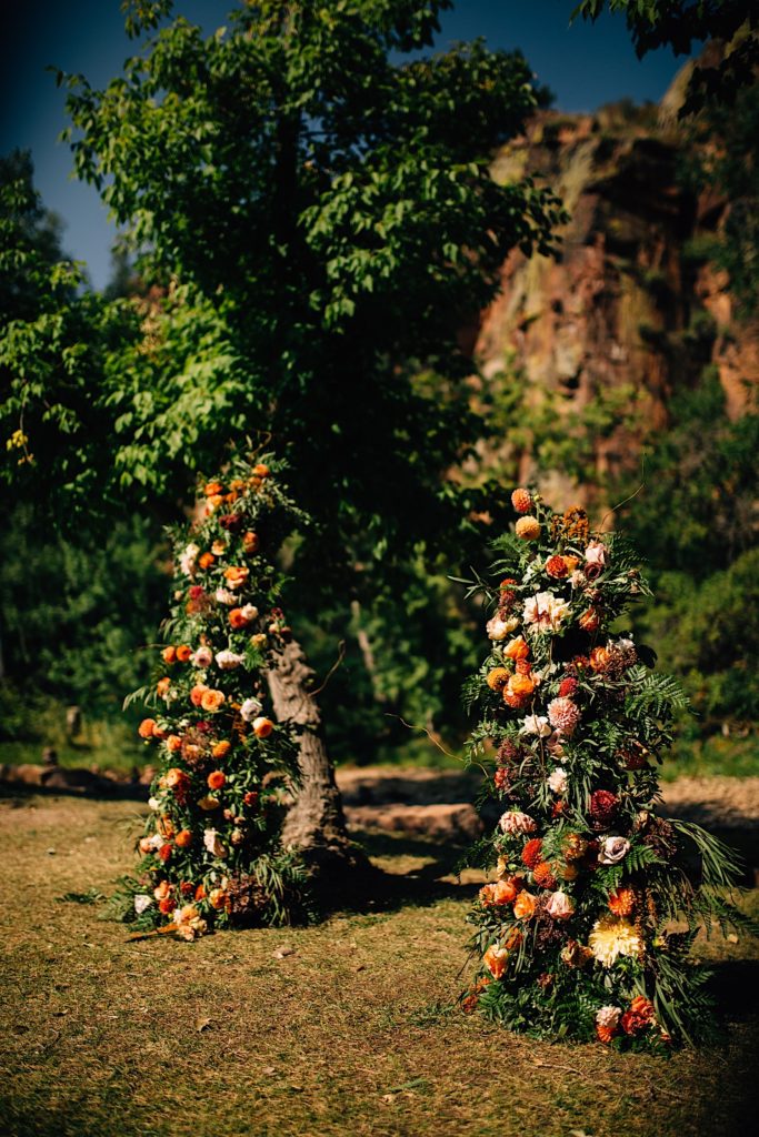 Two towers of flowers used as decoration at Planet Bluegrass's wedding ceremony space
