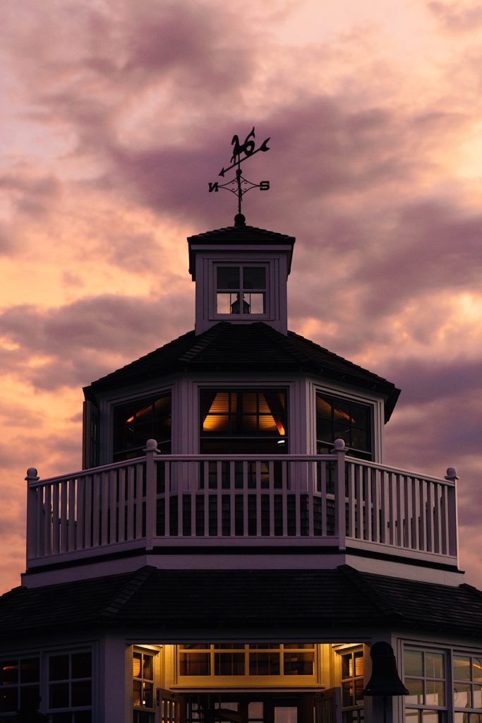 Photo of a lighthouse wedding venue during sunset.
